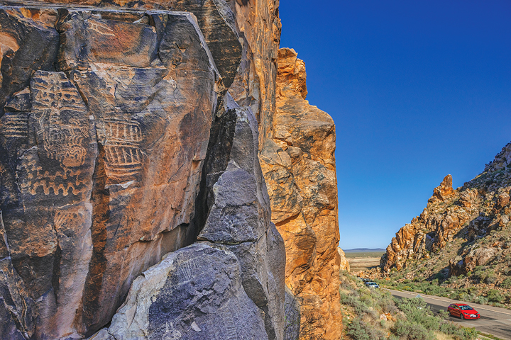 Drivers pass through petroglyph-chiseled cliffs of the Parowan Gap on the Patchwork Parkway.