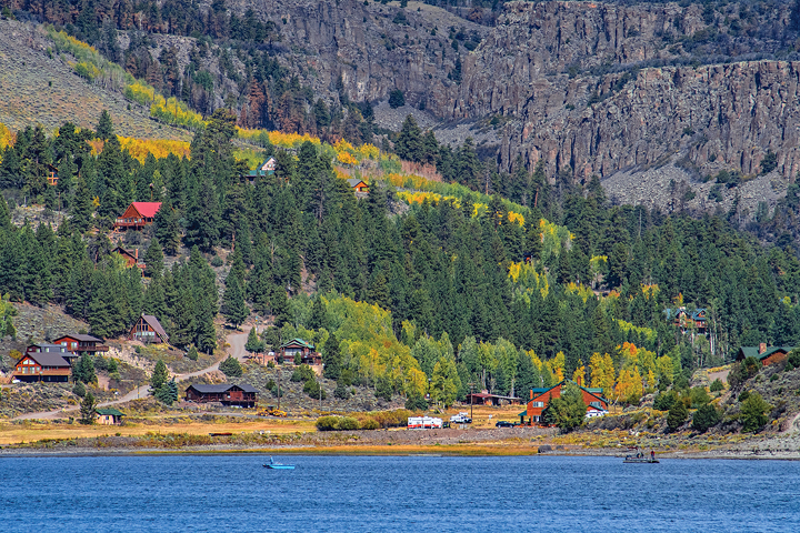 Anglers cast their lines below aspen stands and the volcanic-rock-covered slopes of Panguitch Lake.